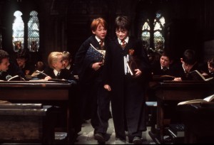 L-R, Ron Weasley (Rupert Grint) and Harry Potter (Daniel Radcliffe) arrive late to class in Warner Bros. Pictures; family adventure movie "HARRY POTTER AND THE SORCERER'S STONE." photo by Peter Mountain. CURRENT MOVIE SKED RELEASE NOV 16.