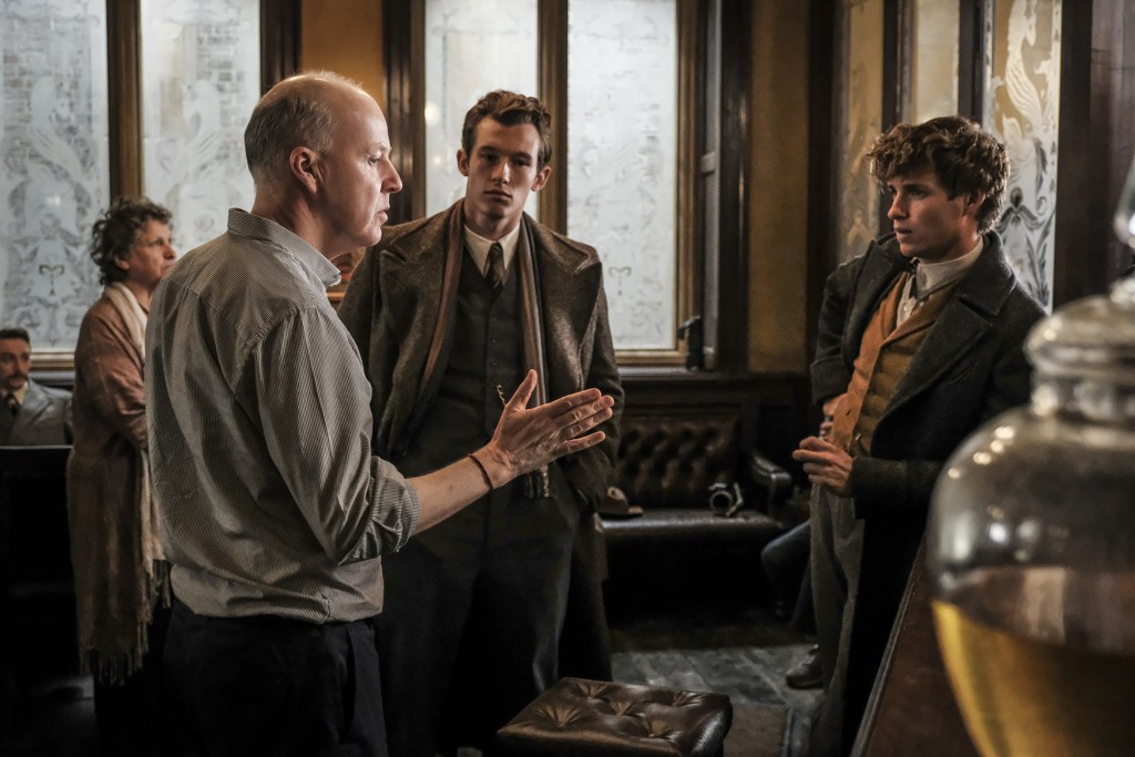 Photo by Jaap Buitendijk (exclusive for Leaky's set visit reports, showing Callum Turner (Theseus Scamander) and Eddie Redmayne (Newt Scamander) on set with director David Yates for 'Crimes of Grindelwald')